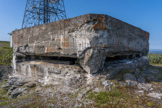 View of German WW2 bunker on mountain during summer with blue sky, Berlevag, Norway.
