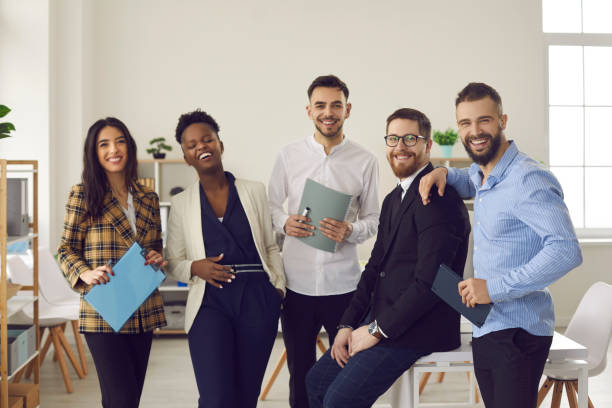 istock Overjoyed young diverse colleagues team have fun laugh in office portrait 2191574212