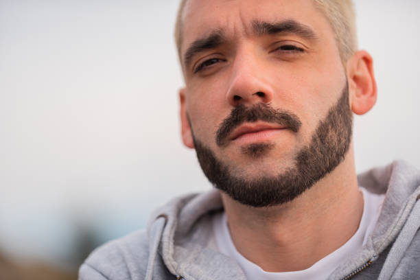 Close up portrait of a young bearded man. High quality photo
