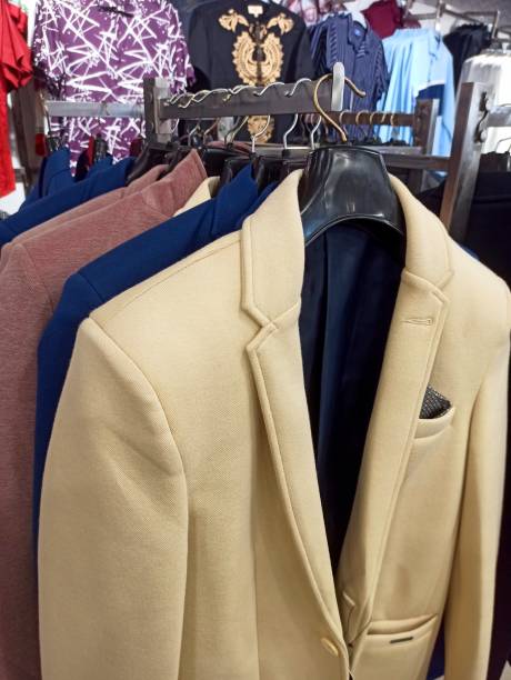istock Men's blazer collection at shopping mall 2191574742