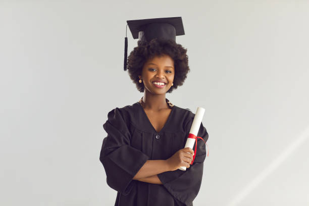 istock African american high school student with graduate certificate portrait 2191574868
