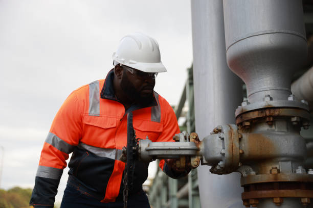 istock A Black male engineer inspects and maintains technical data on system equipment, water pumps, and various valves on piping systems. 2191577127