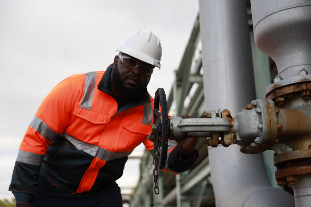 istock A Black male engineer inspects and maintains technical data on system equipment, water pumps, and various valves on piping systems. 2191577140