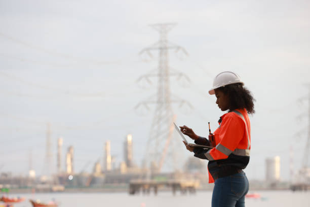 istock A Black female electrical engineer using a laptop computer to stand at the electricity station to see the electric power production plan at a high voltage electrode at the pier 2191577145