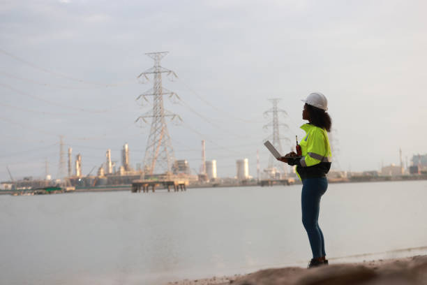 istock A Black female electrical engineer using a laptop computer to stand at the electricity station to see the electric power production plan at a high voltage electrode at the pier 2191577150