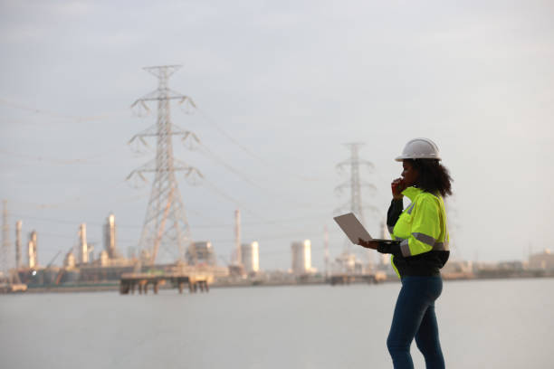 istock A Black female electrical engineer using a laptop computer to stand at the electricity station to see the electric power production plan at a high voltage electrode at the pier 2191577157