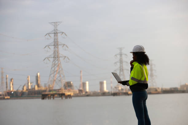 istock A Black female electrical engineer using a laptop computer to stand at the electricity station to see the electric power production plan at a high voltage electrode at the pier 2191577160