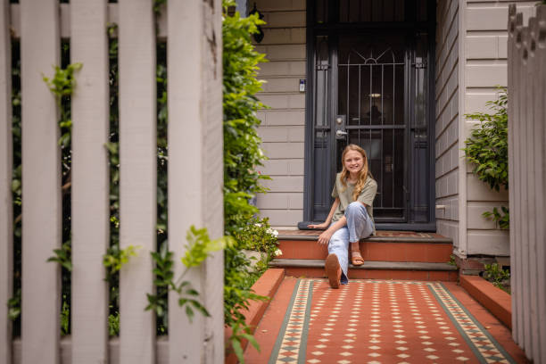istock Young woman enjoying a quiet moment on the steps 2191577751