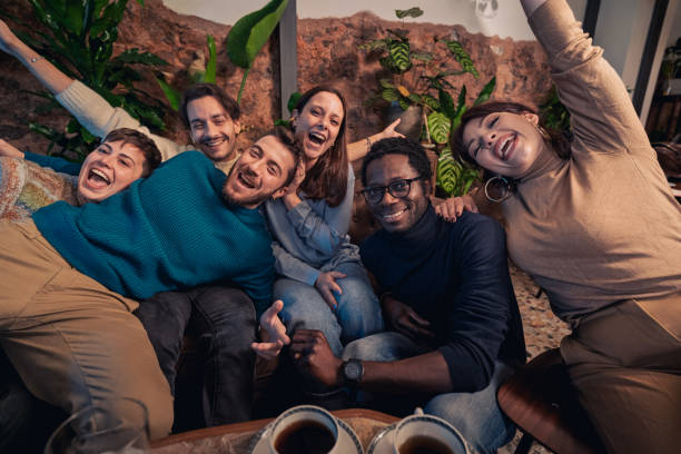 istock Multiracial group laughing at cafe lounge 2191578137