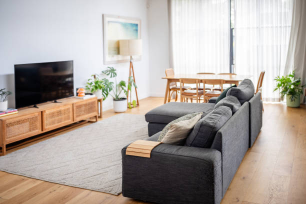 istock Living room with dining area and large grey couch. 2191578992