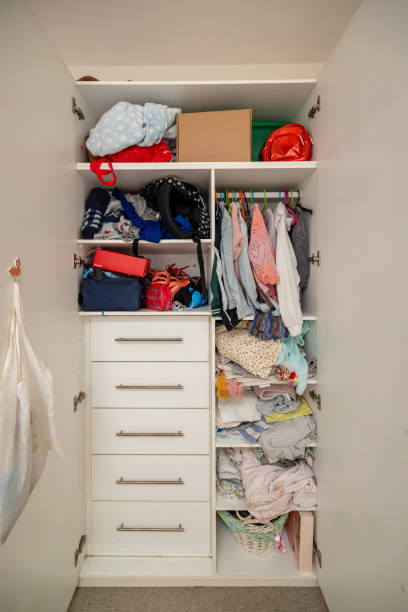 istock Full wardrobe with colorful clothing and storage bins 2191582951