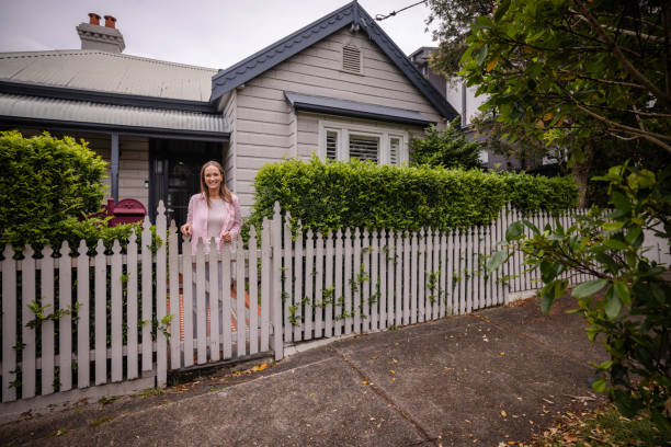 istock Beautiful suburban scene with white picket fence 2191583285