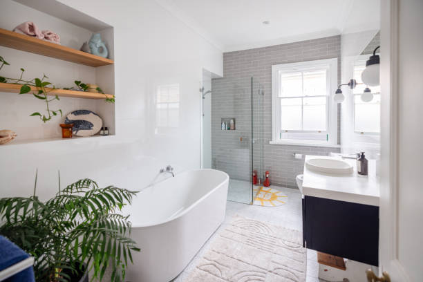 istock Bright bathroom with modern tub and large windows 2191583988