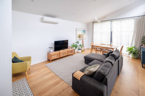 istock Cozy living area with large couch and dining space 2191585190