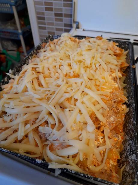 istock Homemade pasta casserole with grated cheese in a baking tray. 2191585204