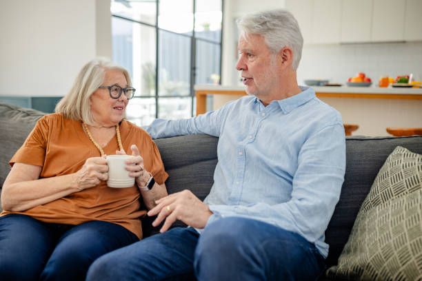 istock Elderly couple engaging in lively living room chat. 2191585499