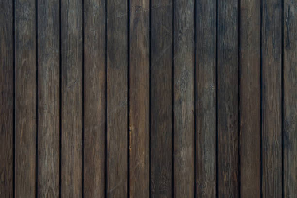 istock Dark wooden plank texture with natural grain and subtle weathered details 2191587992