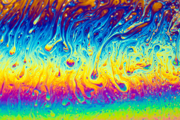 istock Abstract background of a Dynamic interference colors in thin soap films. Bubble rainbow colors. 2191589048
