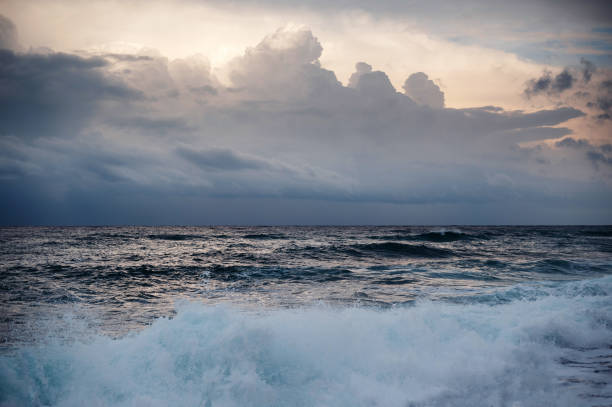 Tornado waterspout in the ocean with heavy rain, lightning and dark dramatic sky, clouds. Extreme weather scene in Australia.