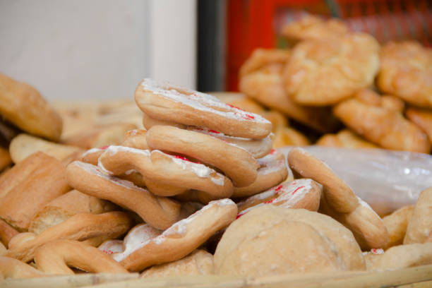 Mexican pastry and bread staked in a basket, close-up.