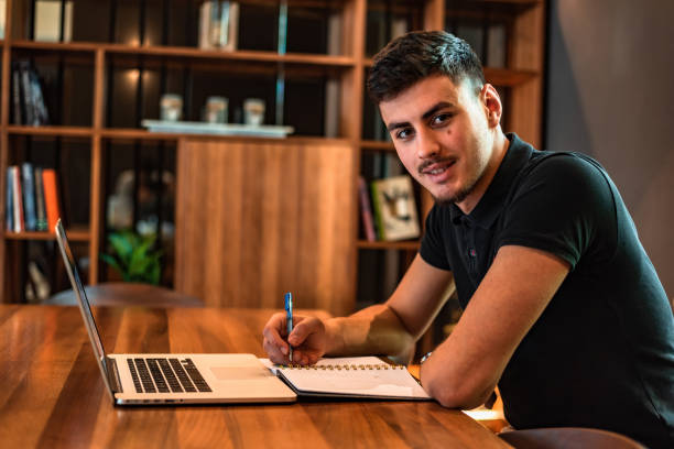 istock A male college student studying in a university library. 2191592827
