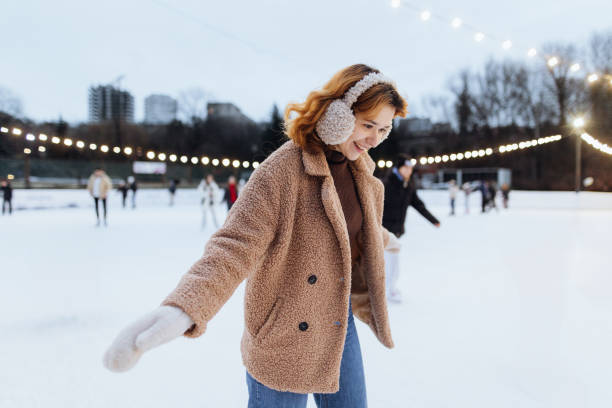istock Cheerful Woman Skating on the Ice Rink 2191593679