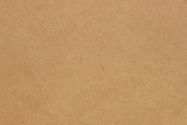 Recycled cardboard texture background offering a natural and sustainable aesthetic, enhancing eco-conscious designs and projects with its earthy tones and unique patterns