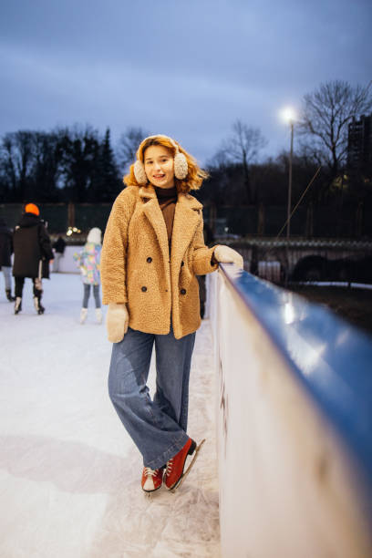 istock Cute woman on the ice rink 2191593911