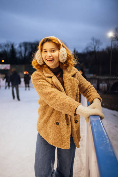istock Woman's firs steps on the ice rink 2191593927