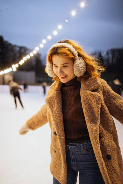 istock Cute woman joyful her ice skating 2191593946