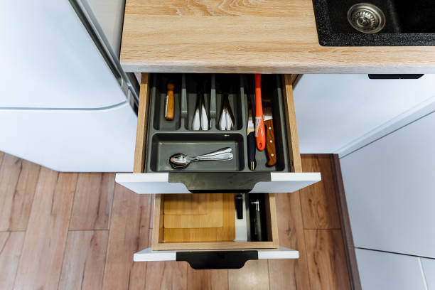 istock This kitchen features a standout drawer that is filled with a fascinating assortment of utensils and knives, showcasing its careful organization and specific purpose for culinary tasks 2191594107