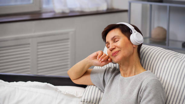 istock Woman deeply immersed in an audiobook 2191594840