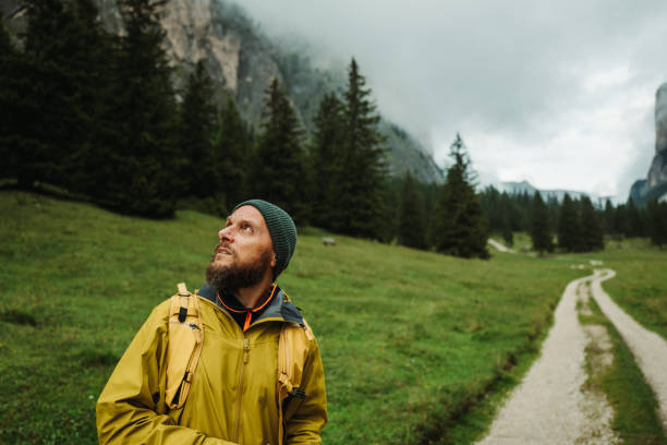 istock Man hiking in a forest trail 2191594974