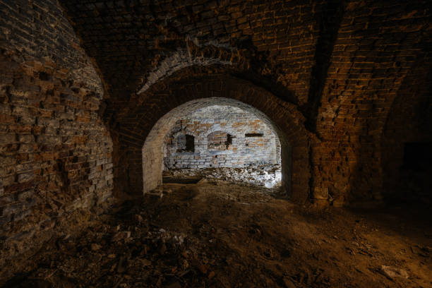 istock Dark and creepy vaulted red brick dungeon 2191595796