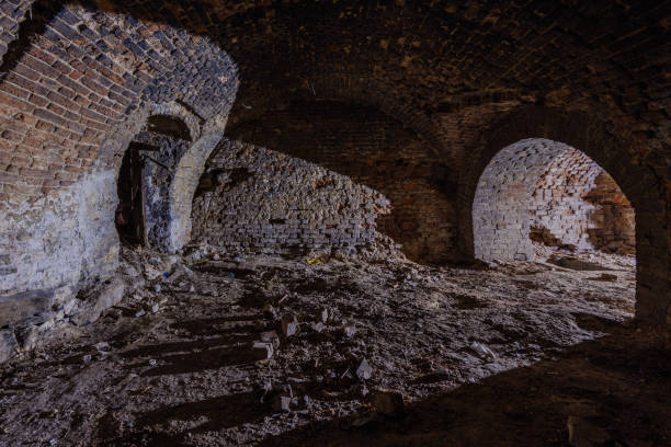 istock Dark and creepy vaulted red brick dungeon 2191595804