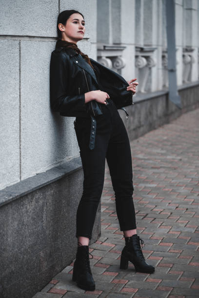 istock Young woman in black 2191595956