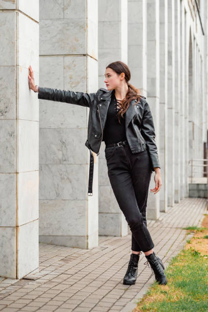istock Young woman in black 2191595959