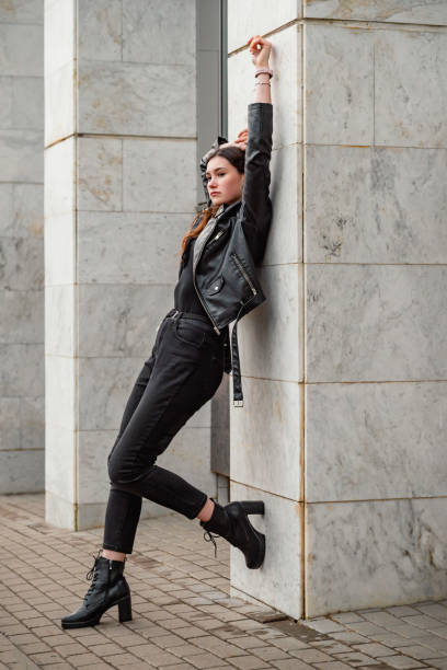 istock Young woman in black 2191595960