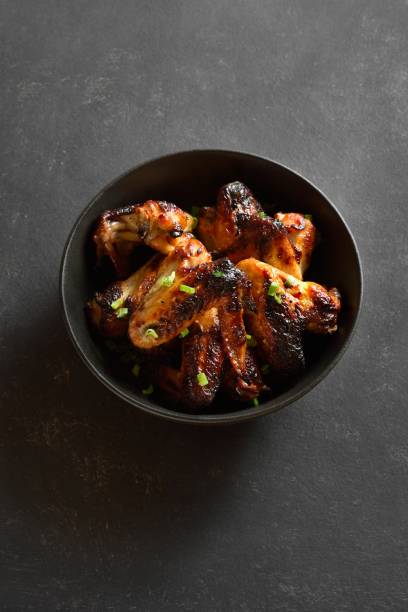 istock Grilled chicken wings in bowl 2191598240