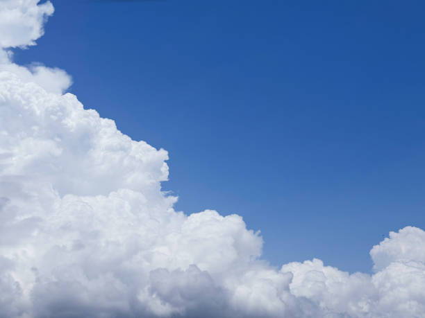 istock Puffy cumulus clouds in blue sky 2191599008