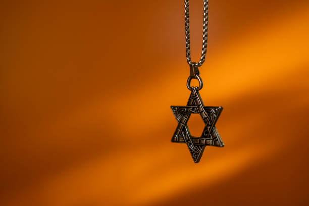 istock Star of David Necklace on Orange background 2191599482
