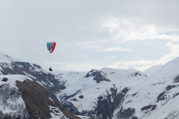 Tandem paragliding in Switzerland Alps, outdoor leisure activity in Interlaken