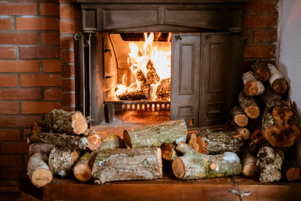 Firewood for oven heating in sauna. Chopped firewood. Oven wood for home heating. Sauna steam room. Steaming in Russian steam bath, Banya, bathhouse. Firewood log for fireplace. Fireplace Stove.