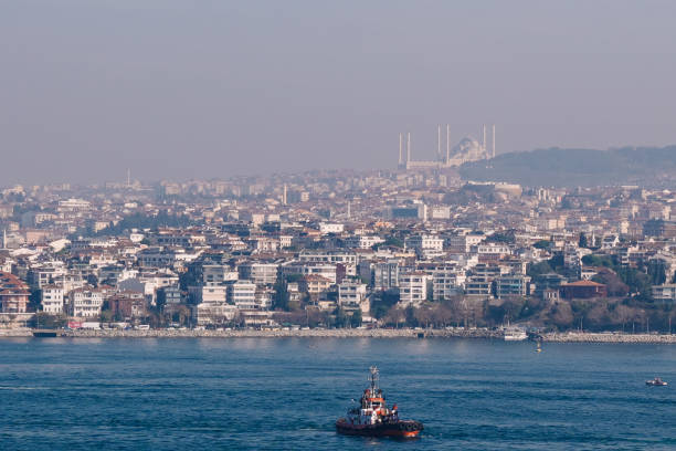 istock Tugboat sailing in bosphorus with Camlica Mosque in the background 2191604811