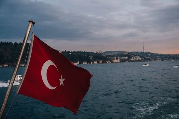 istock Turkish flag waving on bosphorus with Istanbul skyline in background 2191605136