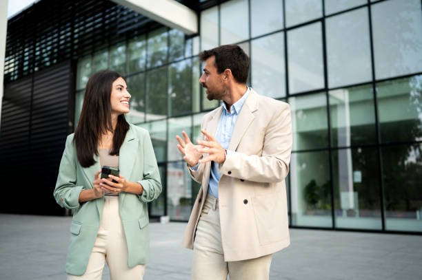 istock Business team outdoor talking and using smart phone 2191608090