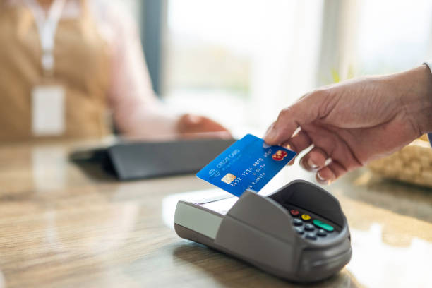istock Anonymous Shopper Using Credit Card at Coffee Shop 2191609924
