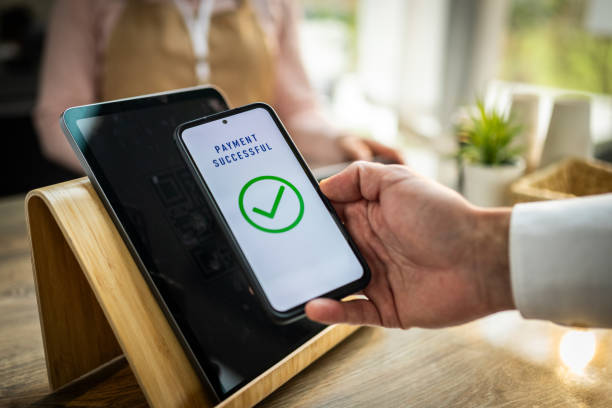 istock Male Customer Scans QR Code for Seamless Coffee Shop Payment 2191609932