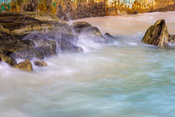 sea shore rock with water mist long exposure shot