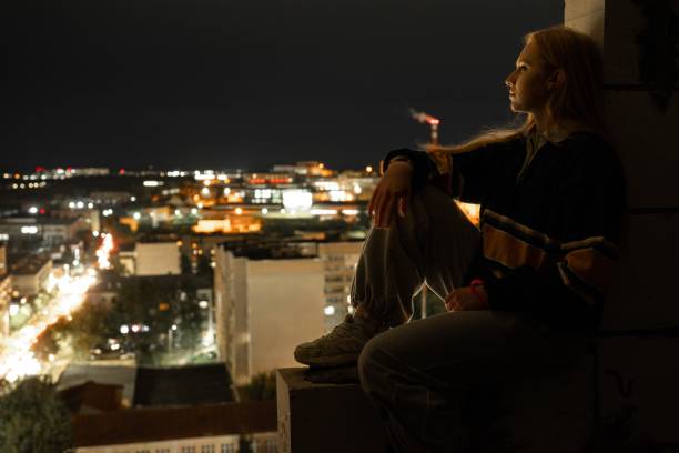 istock Woman on city roof 2191615478